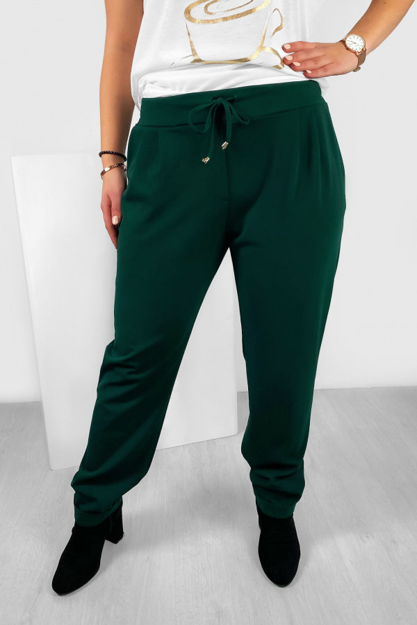 Spodnie damskie materialne w kolorze butelkowej zieleni Tatty